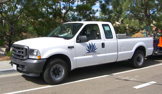 Land system's white pickup truck